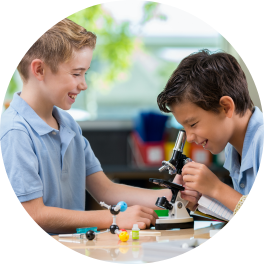 children looking through a microscope and exploring